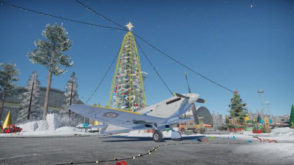 A Spitfire in front of a Christmas tree